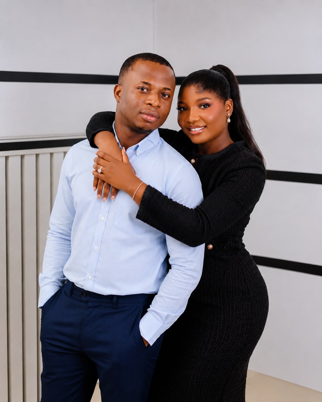 Esther embracing Olaniyi, sharing a relaxed moment together